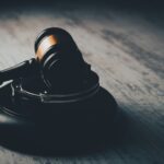 a judge's gaven on a wooden table